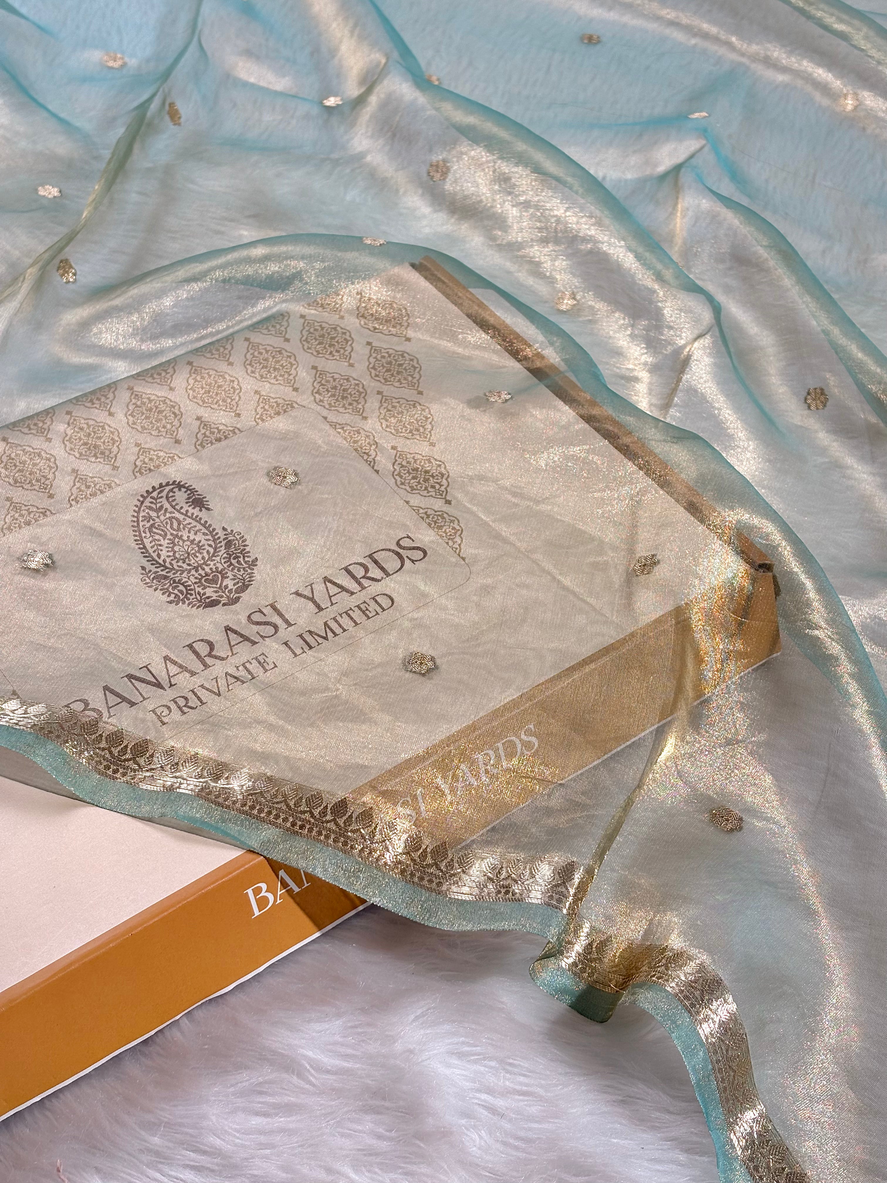 Woven with meticulous precision on traditional Varanasi looms, pure tishu silk banarasi saree.