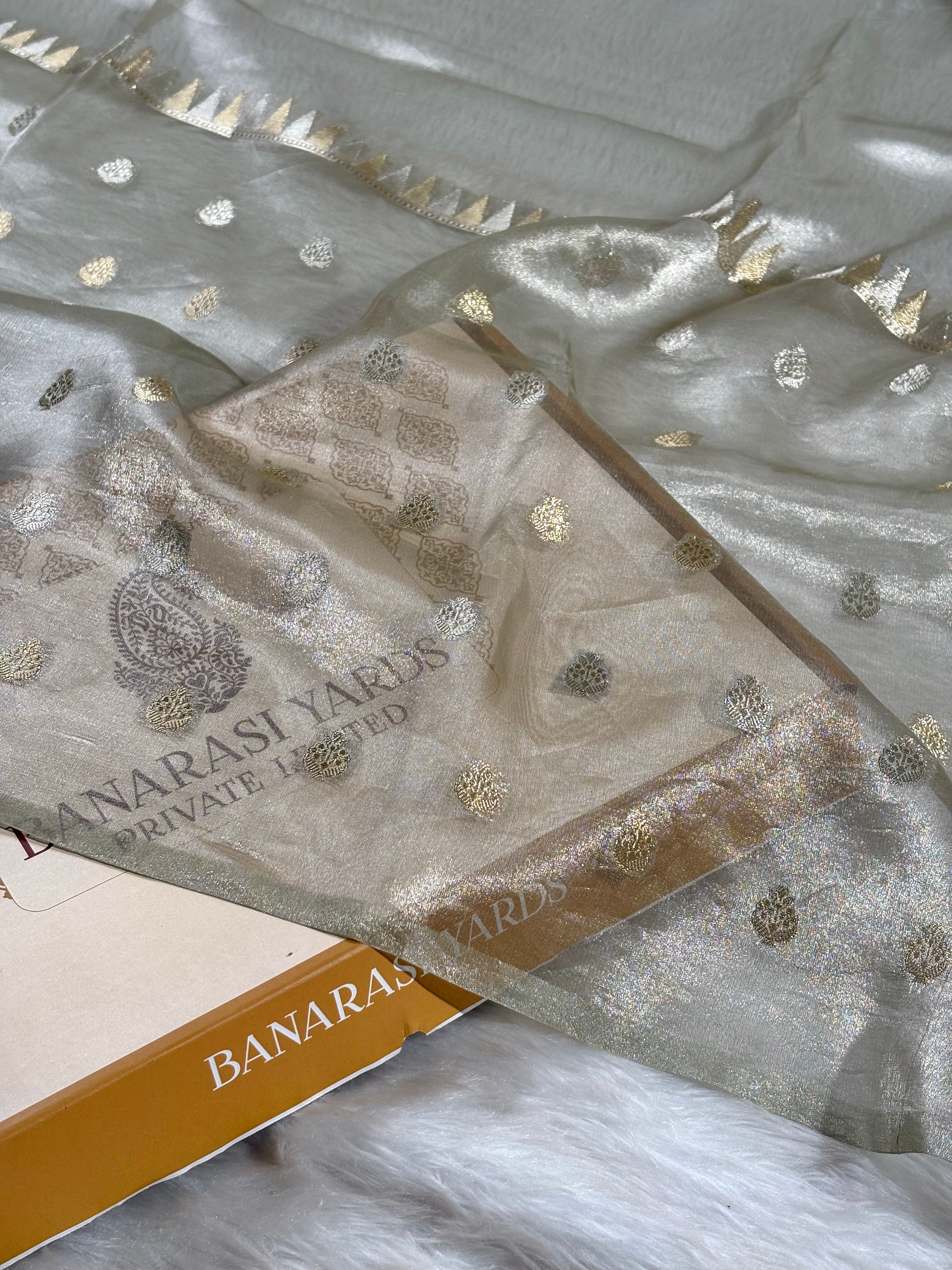 Woven on heritage looms, this saree features delicate Alfi and Mina buti work—intricate floral motifs