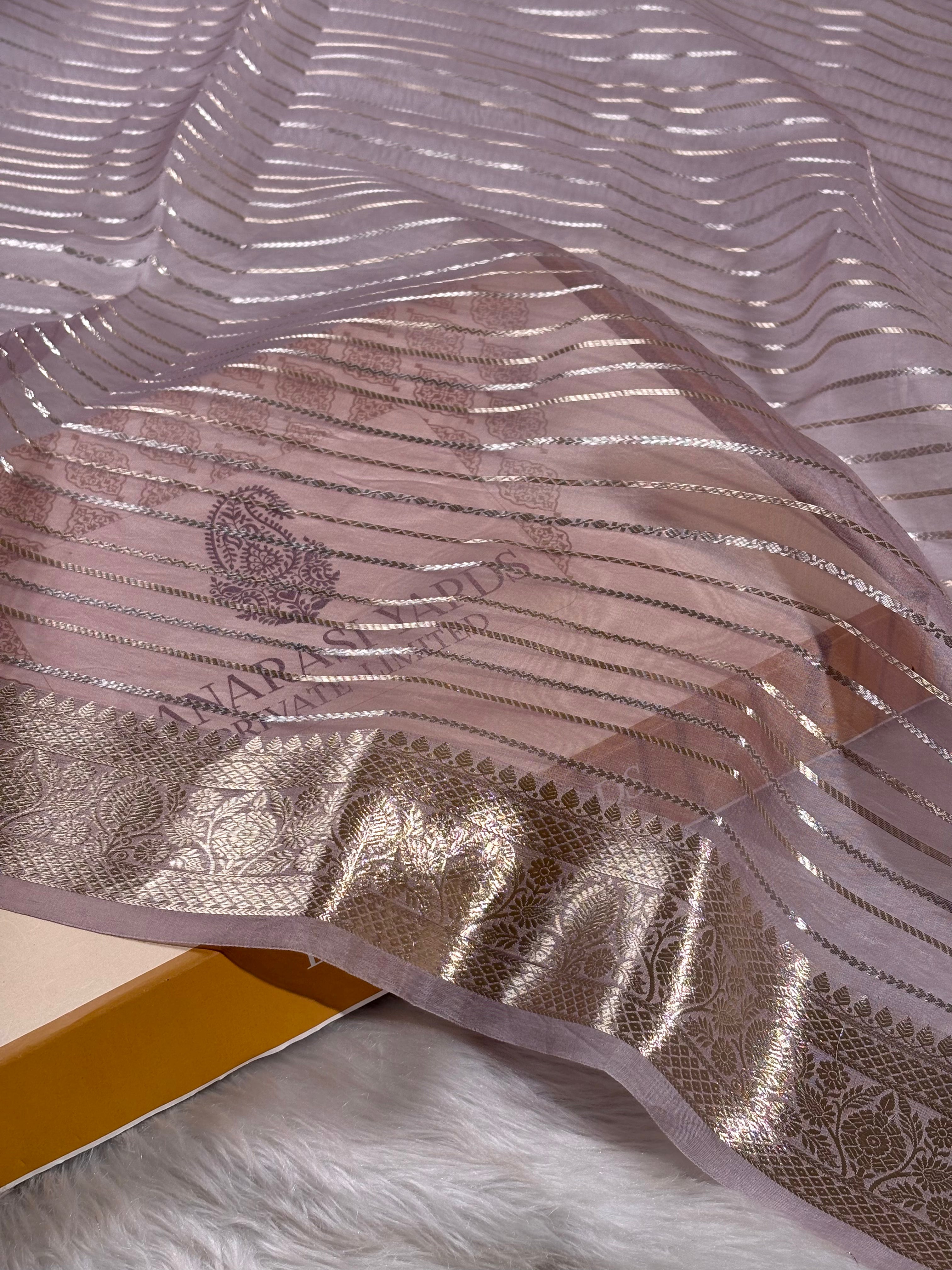 Pure Kora Organza Banarasi saree showcases delicate floral embroidery that celebrates centuries-old craftsmanship. 
