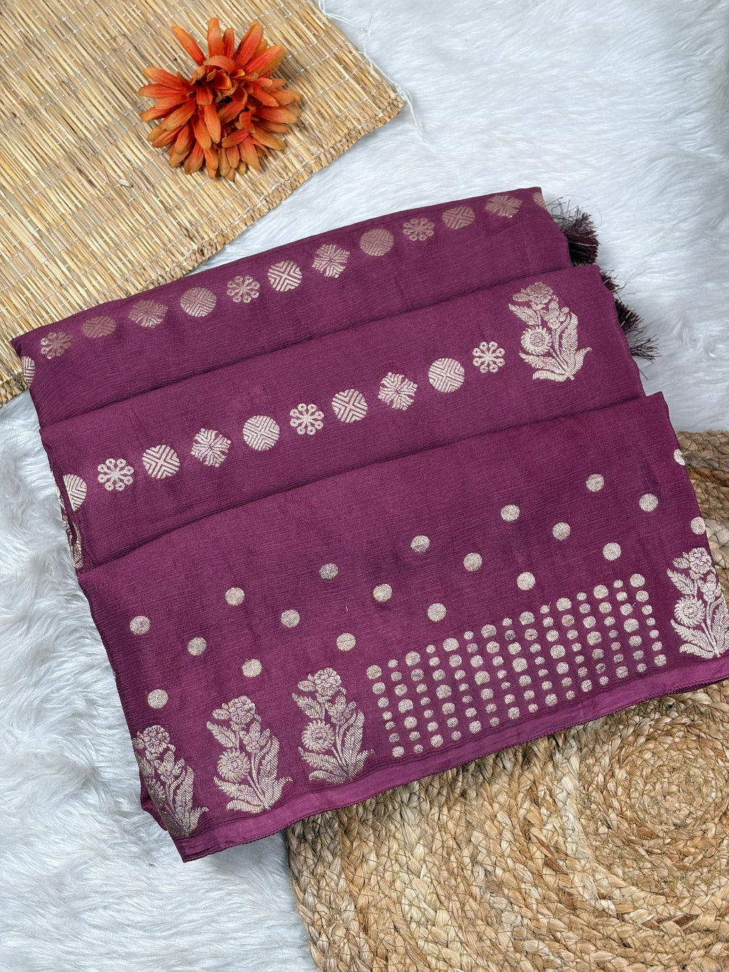 Chinon silk brings a luxurious drape to this Banarasi saree, crafted with intricate motifs that celebrate timeless design.
