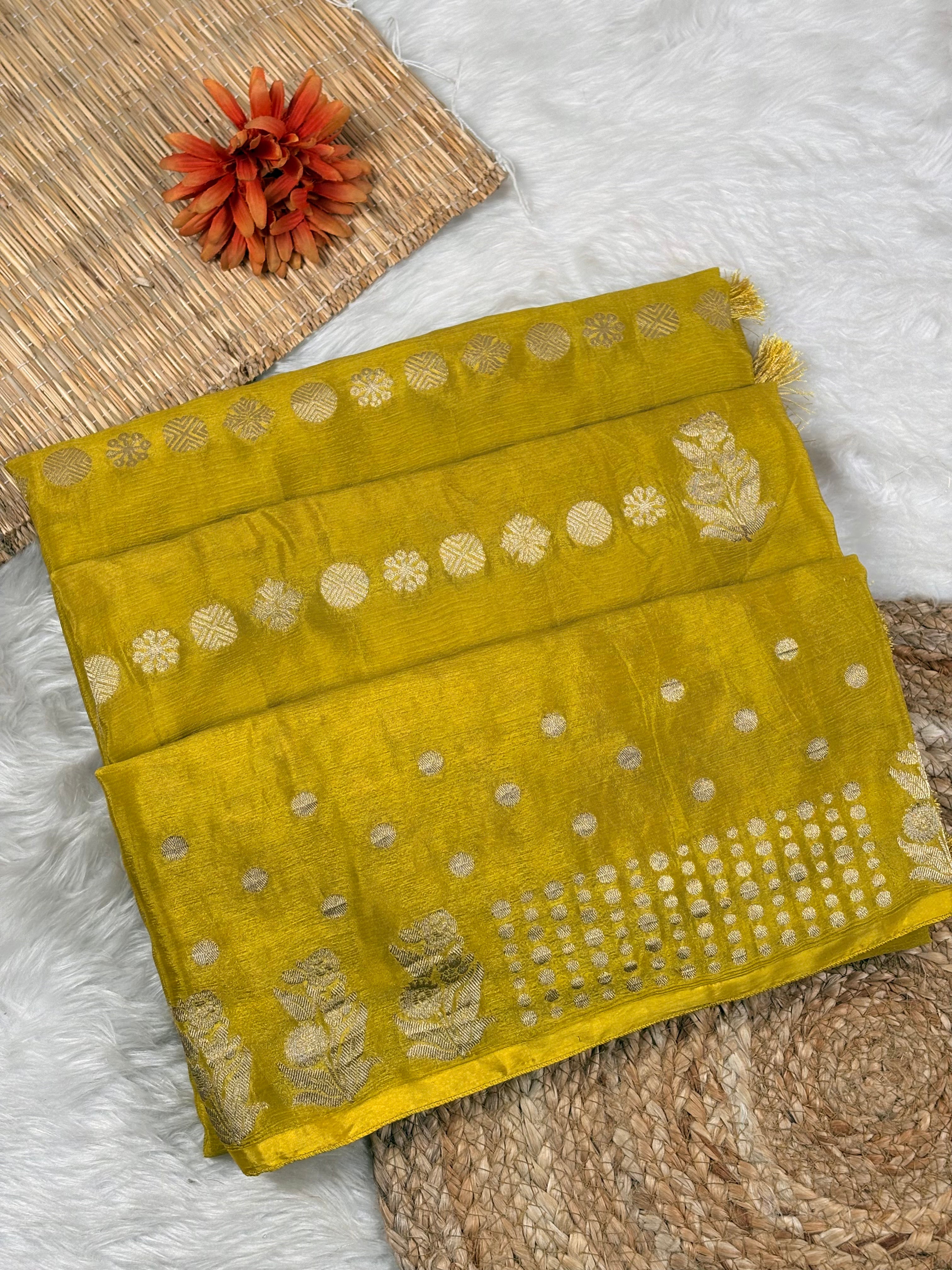 chinon silk, this Banarasi saree combines the timeless elegance of Varanasi's weaving tradition with the luxurious drape and sheen of refined silk.