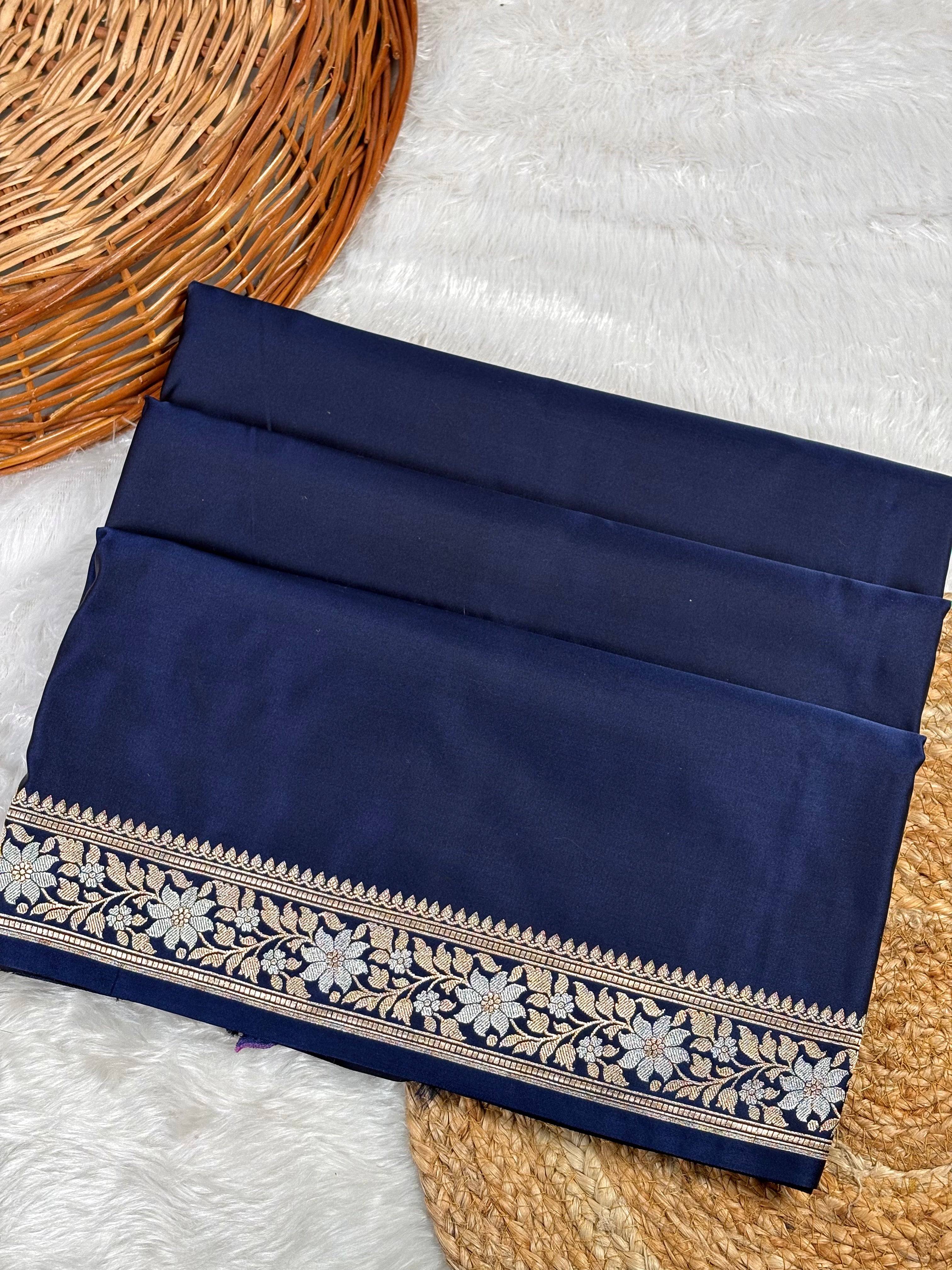 Navy blue saree featuring a detailed floral border in sona rupa concept